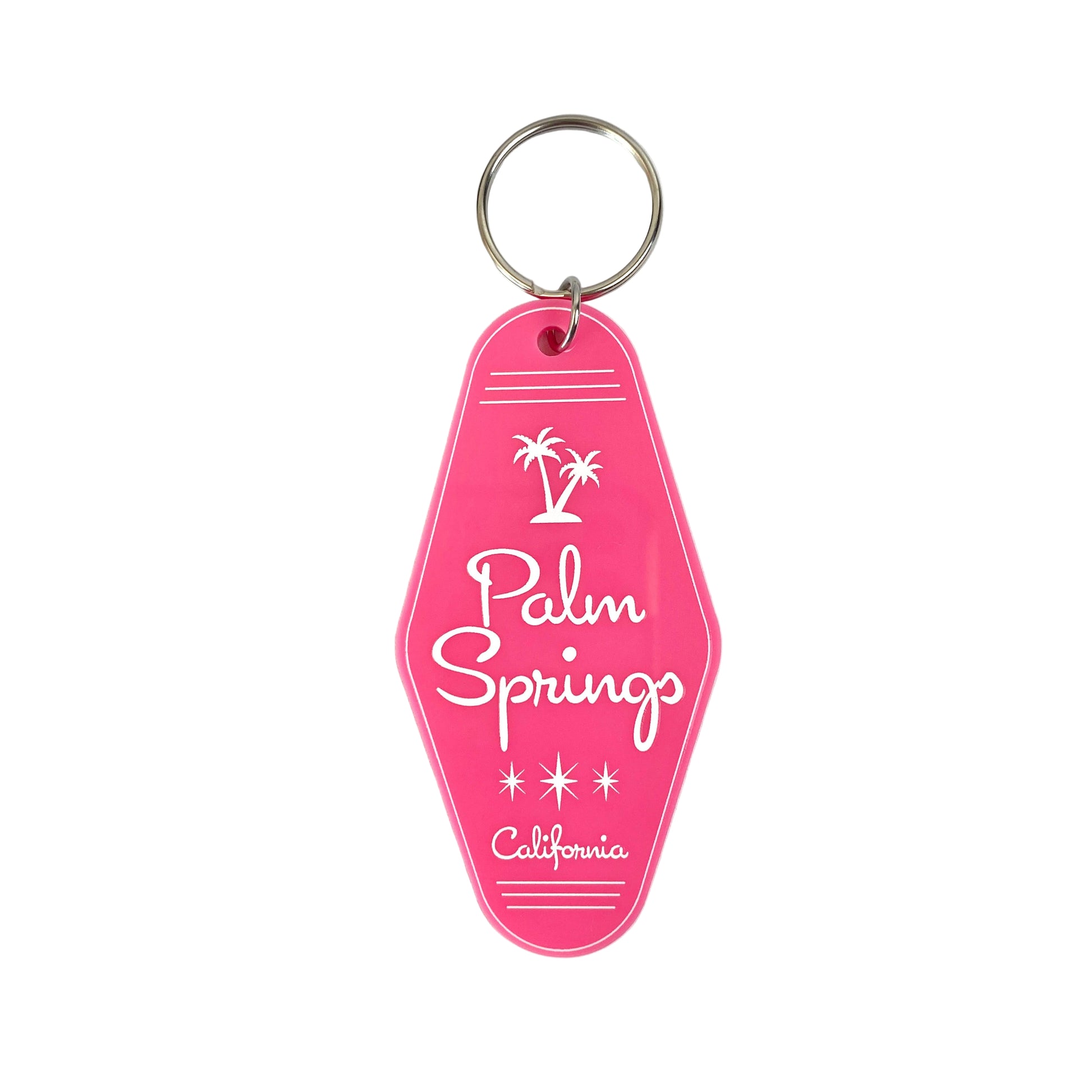 A hot pink keychain with 'Palm Springs California' embossed on it along with an illustration of two palm trees.
