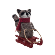 Raccoon On Sleigh Figurine
